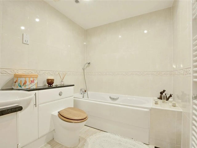 An additional house bathroom is fully fitted with white three-piece suite.