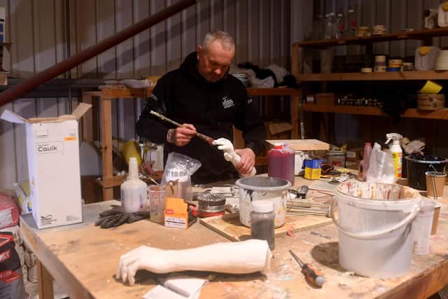 John Foster is pictured with some prosthetics they make at the warehouse. Picture taken by Yorkshire Post Photographer Simon Hulme