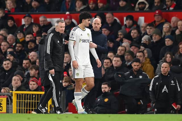 DOUBLE DUTCH - Manchester United manager Erik Ten Hag consoling Leeds United defender Pascal Struijk as he goes off with a suspected concussion at Old Trafford. Pic: Getty