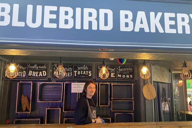 Chris Brain works at Bluebird Bakery, a stall which has had to raise its prices in order to keep up with the increasing cost of ingredients required for their baked goods.