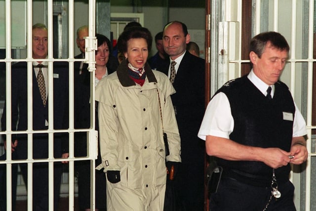 HRH The Princess Royal is led by a prison officer  onto  D Wing at HMP Wealstun at Wetherby in April 1998.