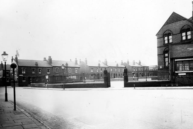 The junction of Gelderd Road and Whitehall Road pictured in August 1948. A belisha beacon crossing is in front of Whitehall Road Council School. The houses of Kildare Terrace are behind.