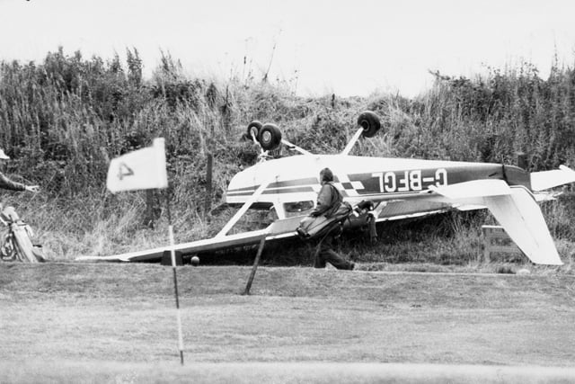 A golfer enjoying a round at Horsforth Golf Club walks past a Cessna 152 which overshot the runway at Leeds Bradford Airport in September 1981. The pilot, Norman Hudson, was unhurt.