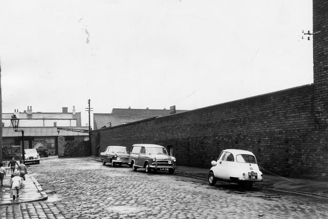 On the left is to the Al-Transport (Leeds) Ltd. To the right is the perimeter wall to the former Crown Bottle Works. Pictured in July 1964.