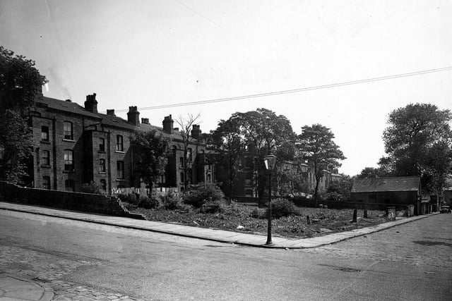 A rear view of large terraced houses fronting the south side of Louis Street in June 1950. In the foreground, running across horizontally from left to right is Hamilton Place. The junction with the cobbled Harriet Street is in the bottom left-hand corner and Harriet Street continues across the other side of Hamilton Place, right.