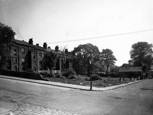 A rear view of large terraced houses fronting the south side of Louis Street in June 1950. In the foreground, running across horizontally from left to right is Hamilton Place. The junction with the cobbled Harriet Street is in the bottom left-hand corner and Harriet Street continues across the other side of Hamilton Place, right.