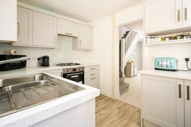 Located right off the staircase - the kitchen is well fitted with a range of wall and base mounted units.