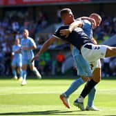PRAISE: For Leeds United's Charlie Cresswell, front, pictured challenging Jake Bidwell during August's clash against Coventry City at The Den.
Photo by Chloe Knott/Getty Images.
