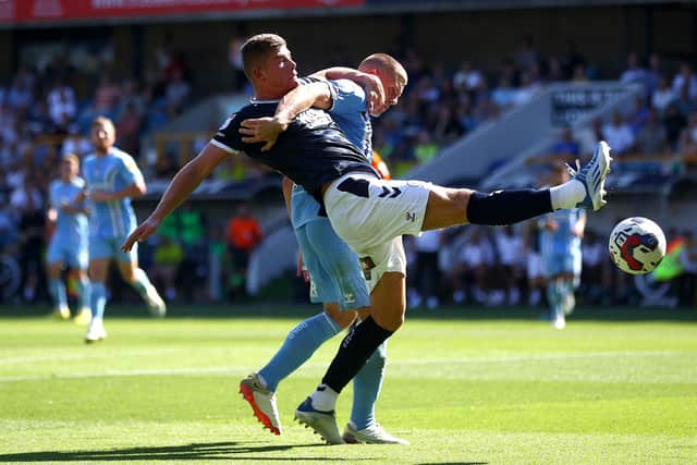 PRAISE: For Leeds United's Charlie Cresswell, front, pictured challenging Jake Bidwell during August's clash against Coventry City at The Den.
Photo by Chloe Knott/Getty Images.