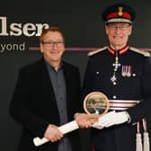 LL Ed Anderson presents the King’s Award scroll to Ashley Bolser