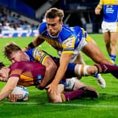 Leeds Rhinos' Ned McCormack and Presley Cassell prevent Aidan McGowan from scoring what seemed a certain try during last week's 26-0 win at Huddersfield Giants. Picture by Allan McKenzie/SWpix.com.