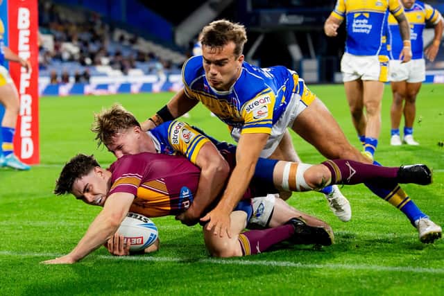 Leeds Rhinos' Ned McCormack and Presley Cassell prevent Aidan McGowan from scoring what seemed a certain try during last week's 26-0 win at Huddersfield Giants. Picture by Allan McKenzie/SWpix.com.