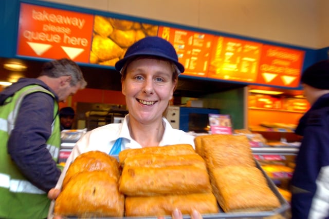 Shop support manager at Greggs on The Headrow Sue Abbott holds a tray of Cornish pasties, sausage rolls and chicken pasties in January 2004.