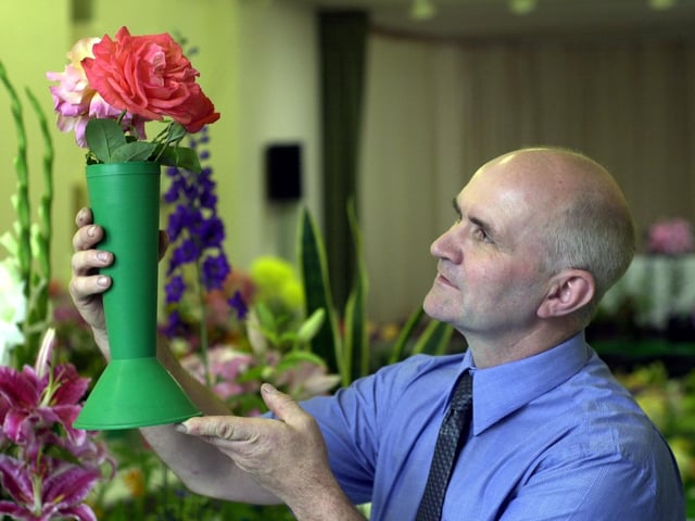 Calverley Horticultural Society's 81st annual show was staged in Calverley Methodist Church Hall in August 2002. Pictured is judge Stephen Ryan studying one the exhibits.