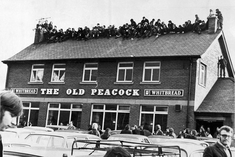 Fans who failed to get into Elland Road for the FA Cup fourth round replay against Liverpool in February 1972 enjoyed a high-level view of the match from the roof of The Old Peacock pub.