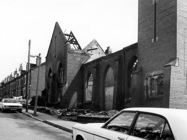 The former Ashley Road Methodist Church which had been recently used as a furniture warehouse when this photo was taken in May 1984 The damage is thought to have been caused by a fire and the building had to be demolished. Members of the church had moved to a newer building, off camera, right, at the corner with Ashton Mount, several years before. This view is taken from Darfield Crescent and shows back-to-back terraced housing. Just behind the car on the left, Ashton Mount cuts across Darfield Crescent. Ashley Road Methodist Church dates from 1906 and was built to seat 400 persons at a cost of £3,000. P