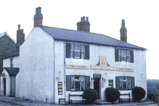 The Cardigan Arms on Dewsbury Road pictured in May 1963. It was named after the Lord of the Manor, the Earl of Cardigan and at this time the ale was supplied by Ind Coope. Signs advertise 'Light Snacks' and meals of 'Ham and Eggs' and Steak and Chips'. It was demolished in 1972.