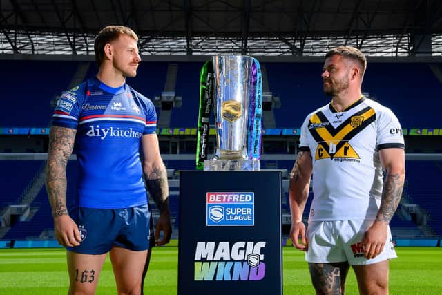 Wakefield Trinity's Tom Johnstone, left and Liam Hood, of Castleford Tigers, with the Betfred Super League trophy at Hill Dickinson Stadium in Liverpool. Picture by Allan McKenzie/SWpix.com.