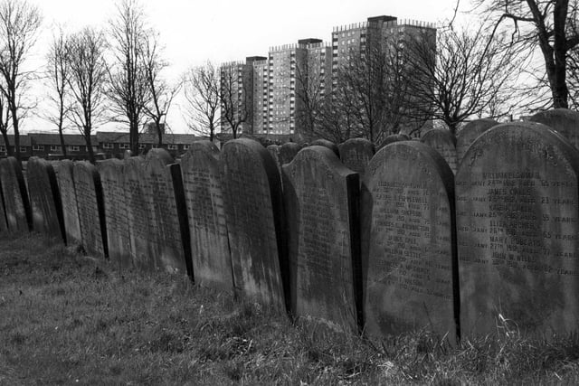 Beckett Street cemetery showing rows of inscription graves or 'guinea graves'. The graves on the right here date from 1912. In the background are the high-rise flats of Shakespeare Towers, Court and Grange.