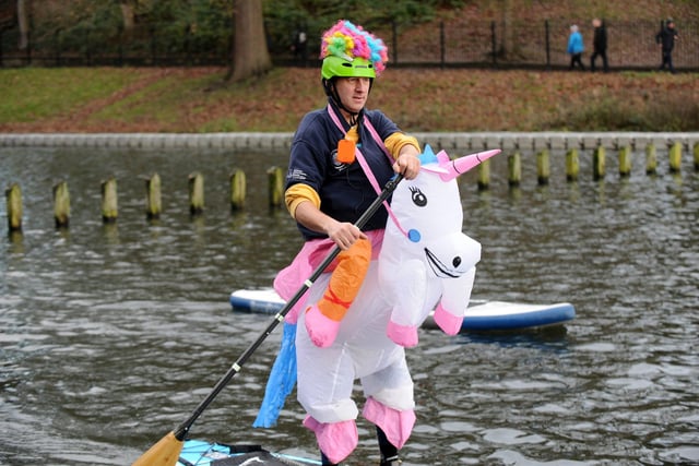 Dean Jordan, pictured wearing a unicorn outfit on the paddle board.