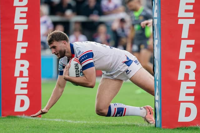 Josh Rourke scores for Wakefield Trinity during last weekend's 44-6 rout of Catalans Dragons. Picture by Alex Whitehead/SWpix.com.