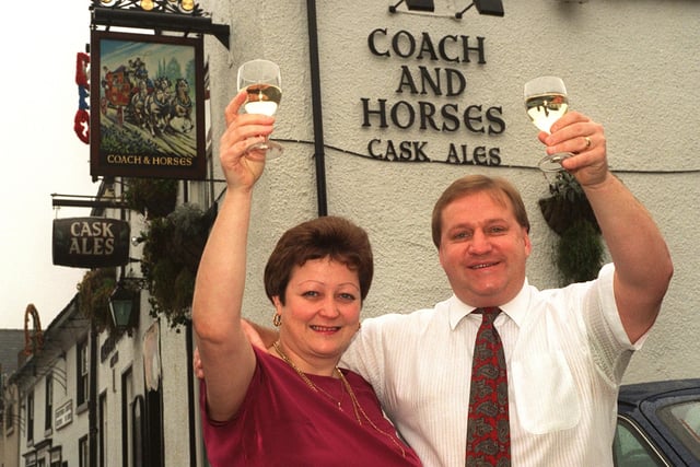 Licencee of the Coach and Horses pub, Commercial Street, Rothwell, Val Goldthorpe, pictured with her husband Rob celebrating it pub being nominated Community Pub of the Year in 1997.
