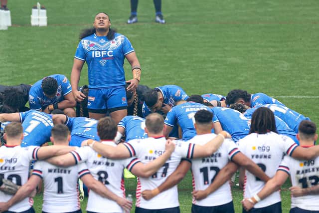 England face Samoa's Siva Tau before last Sunday's first Teszt. Picture by Paul Currie/SWpix.com.