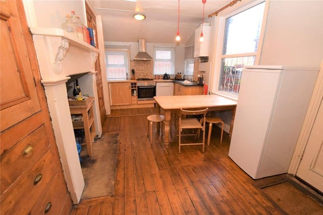 The breakfast kitchen has base units and original built in storage cupboard, electric oven with gas hob and extractor fan above. There is also for a dining table, plumbing for a dishwasher and door giving access to the rear yard.