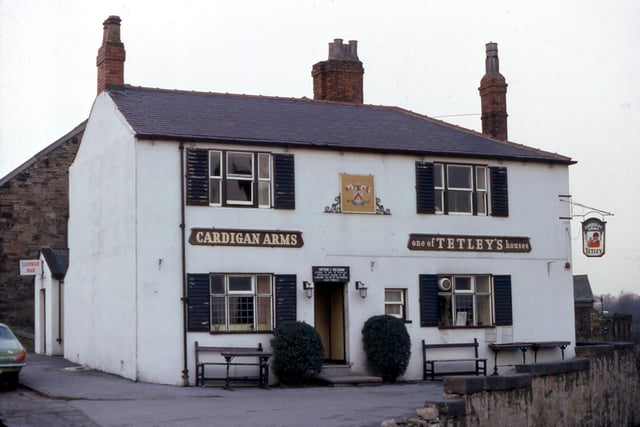The Cardigan Arms in Dewsbury Road pictured in February 1971. The painted sign on the white-rendered exterior wall depicts the arms of the Cardigan family, Lords of the Manor.