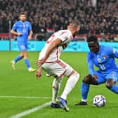 Hungary's defender Willi Orban (L) and Italy's forward Degnand Wilfried Gnonto vie for the ball during the UEFA Nations League Group 3 football match between Hungary and Italy in Budapest on September 26, 2022. (Photo by Attila KISBENEDEK / AFP) (Photo by ATTILA KISBENEDEK/AFP via Getty Images)