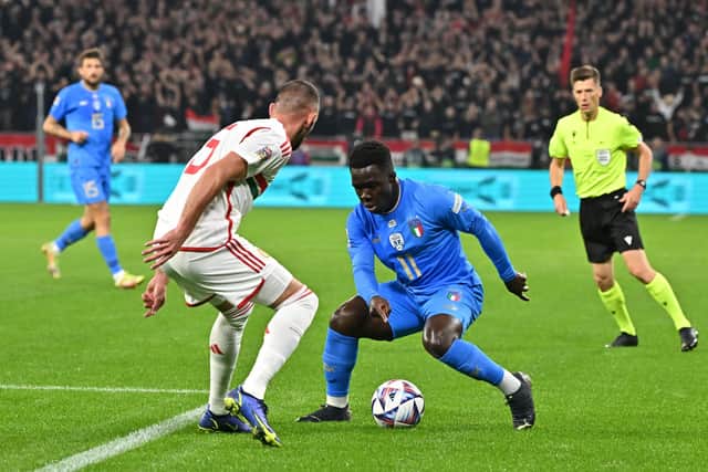 Hungary's defender Willi Orban (L) and Italy's forward Degnand Wilfried Gnonto vie for the ball during the UEFA Nations League Group 3 football match between Hungary and Italy in Budapest on September 26, 2022. (Photo by Attila KISBENEDEK / AFP) (Photo by ATTILA KISBENEDEK/AFP via Getty Images)