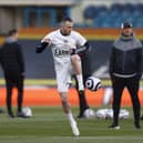 'EARN IT': Leeds United's Jack Harrison warms up wearing a protest t-shirt against the European Super League prior to the Premier League hosting of Liverpool last April. 
Photo by Lee Smith - Pool/Getty Images.