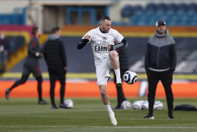 'EARN IT': Leeds United's Jack Harrison warms up wearing a protest t-shirt against the European Super League prior to the Premier League hosting of Liverpool last April. 
Photo by Lee Smith - Pool/Getty Images.
