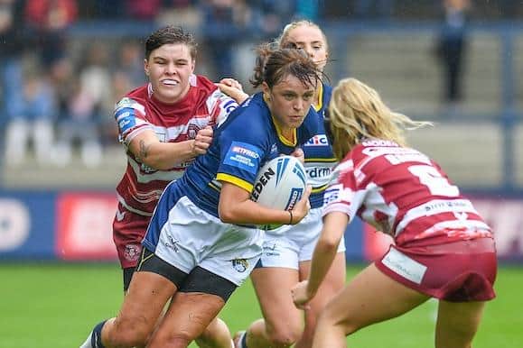 Rhinos captain Hanna Butcher is tackled by Molly Jones during the Cup semi-final defeat of Wigan Warriors. Picture by Olly Hassell/SWpix.com.