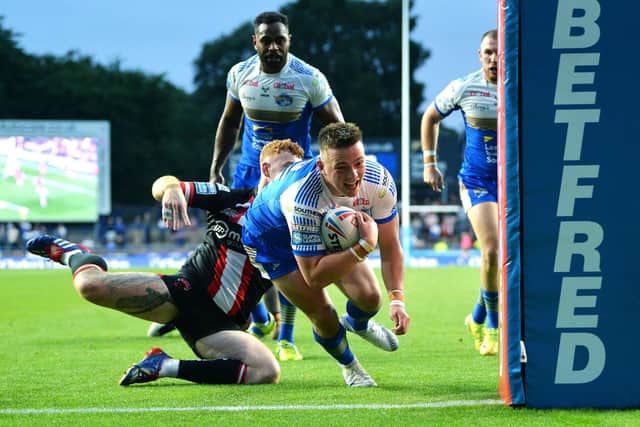 Callum McLelland scores for Rhinos against Salford in July, 2021. Picture by Jonathan Gawthorpe.
