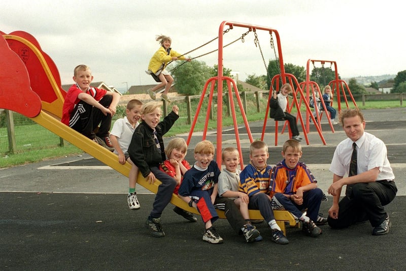 Mark Dillworth (right) from the Friends of Hesketh Lane Recreation Ground with some of the local children  enjoying a new play area in July 1999.
