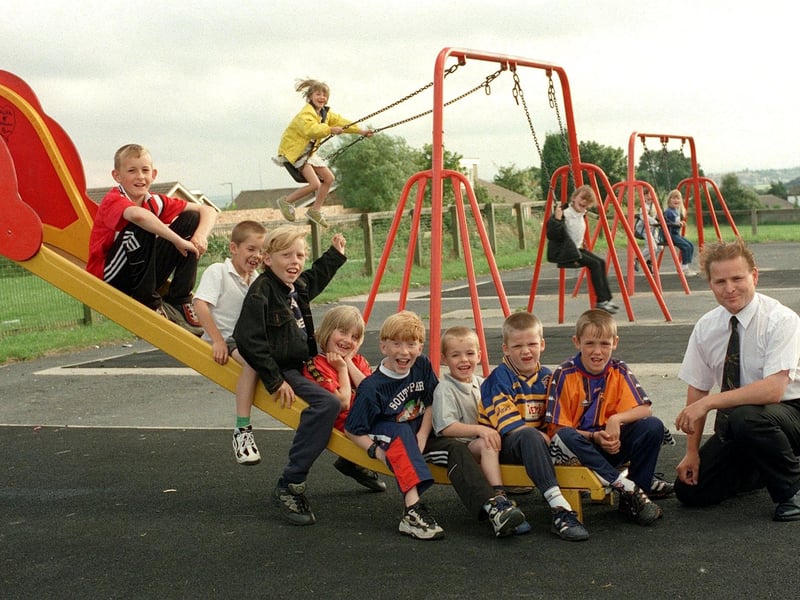 Mark Dillworth (right) from the Friends of Hesketh Lane Recreation Ground with some of the local children enjoying a new play area in July 1999.