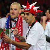 NEWELL'S OLD BOY - Maxi Rodriguez, pictured with Martin Skrtel and Luis Suarez after winning the Carling Cup with Liverpool, has made a pilgrimage to Leeds to be pictured beneath a Marcelo Bielsa Leeds United mural. Pic: Getty