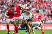 Leeds Rhinos Mitch Garbutt is tackled by Hull KR's Dane Tilse in the 2015 Challenge Cup final. Picture by Alex Whitehead/SWpix.com.