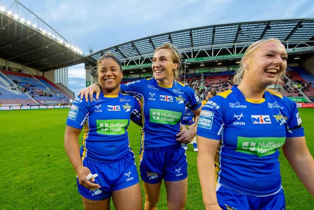 Kaiya Glynn, Caitlin Casey and Keara Bennett celebrate after Leeds Rhinos completed their league season with a 24-4 victory at Wigan Warriors. Picture by Allan McKenzie/SWpix.com.