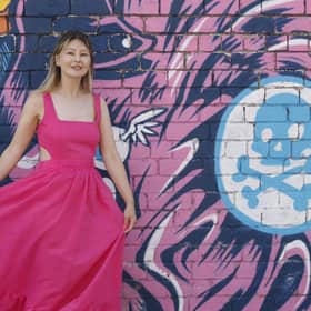 Smart Works Leeds staff member Keziah wears a pink dress donated by influencer Emma Worthington @swoon_love for the Smart Works Leeds charity fashion sale at Mabgate Mills in Leeds on Wednesday, July 5, from 5.30pm. Tickets £5. Picture: Lottie Roberts
