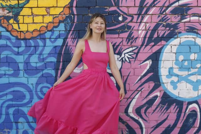 Smart Works Leeds staff member Keziah wears a pink dress donated by influencer Emma Worthington @swoon_love for the Smart Works Leeds charity fashion sale at Mabgate Mills in Leeds on Wednesday, July 5, from 5.30pm. Tickets £5. Picture: Lottie Roberts
