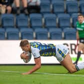 Sam Walters scores the first of his two tries in Rhinos' big win over Huddersfield.  Picture by Bruce Rollinson.
