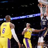 LEEDS INTEREST -  Larry Nance Jr of the New Orleans Pelicans dunks in front of Anthony Davis and LeBron James of the Los Angeles Lakers. The 6ft 8ins Pelicans man has taken an interest in Leeds United. Pic: Getty