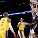 LEEDS INTEREST -  Larry Nance Jr of the New Orleans Pelicans dunks in front of Anthony Davis and LeBron James of the Los Angeles Lakers. The 6ft 8ins Pelicans man has taken an interest in Leeds United. Pic: Getty