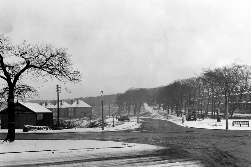 Queenswood Drive at the junction with Kirkstall Lane in February 1956. Langdale Terrace is in the background.