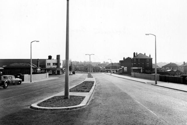 September 1955. Completed Cross Gates Bridge on Station Road. New central reservation in road with electric streetlight fittings. Ritz cinema on left.