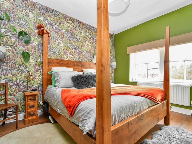 Upstairs, there are three elegantly appointed bedrooms, each filled with natural light and offering ample storage space.
