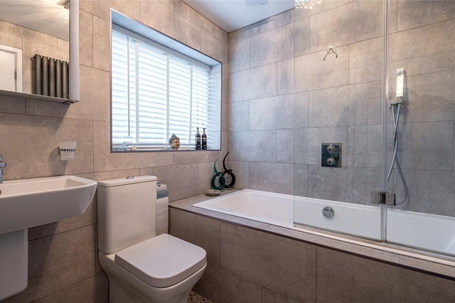 A stunning house bathroom which incorporates a three-piece suite.