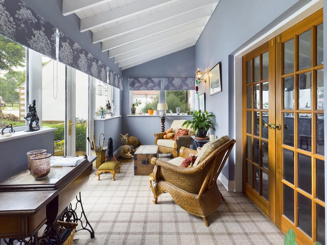 The sun room looks out over the gardens.